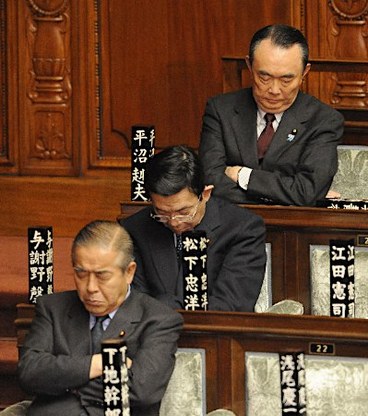 Chinese parliament members taking a quick nap.
