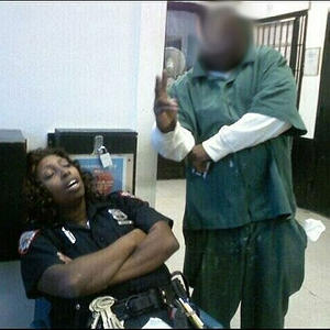 Inmate Posing with Sleeping Corrections officer. Wait is a inmate taking the picture or an employee?
