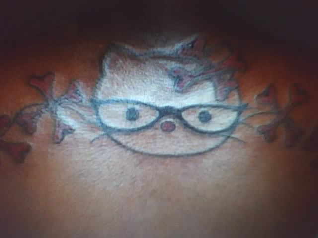 cat tattoo on black chick