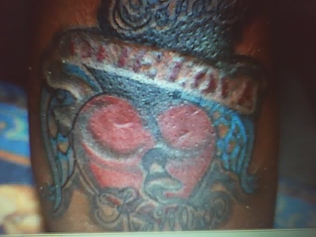 heart tattoo on black male or female i think this is a guy