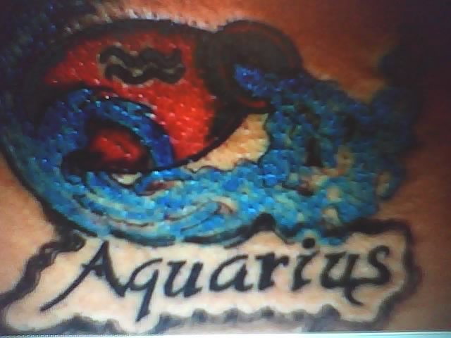 aquarius tattoo on black chick