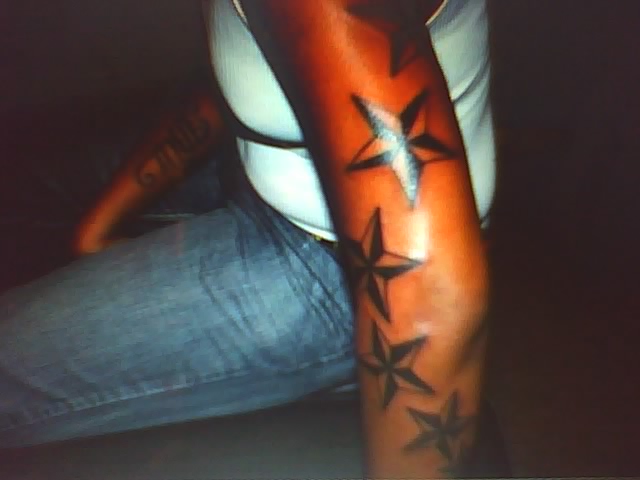 stars tattoo on black chick 
