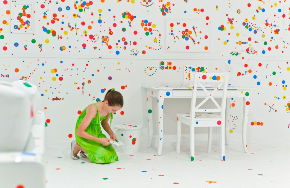 Artist let kids put stickers all over a white room