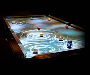 Interactive Pool Table 25,000.00 Play billiards on this digitally upgraded pool table that interacts with every movement of the pool balls. Custom set high definition imagery displays underneath each ball, and more of the image gets revealed as the pool balls roll over this high class pool table.