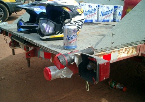 Spend all you money on beer? Fix that broken taillight with a flashlight and some electric tape!
