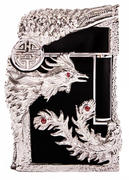 Lighters Direct is known as the worlds premier online shopping center for consumers looking for luxury lighters and cigar accessories. As of today, the establishment is adding a new treat to its collection, aptly named the S.T. Dupont Black Limited Edition Ligne 2 Lighters. It is roughly following the design and model of the S.T. Dupont Phoenix Prestige Limited Edition Ligne 2, although the new line is better in terms of its enhanced finishes.The Phoenix Black lighter is decorated with Chinese lacquer, white bronze patina and embedded rubies. With only 12 Ligne 2 lighters made with this distinguished finish, these products are rare indeed. All 12 products are available exclusively at Lighters Direct. The Phoenix Black lighter is priced at 16, 500.