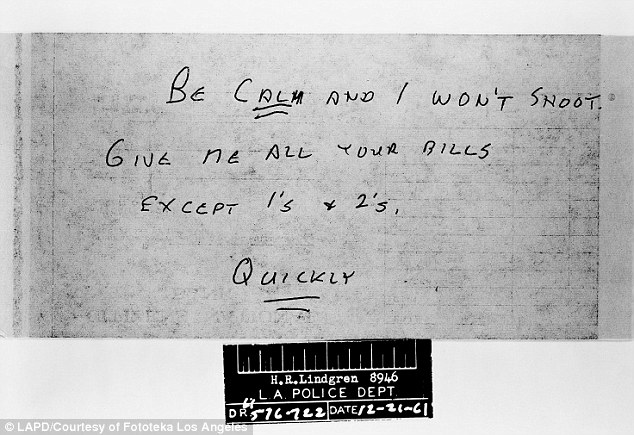 A demand note taken as evidence from a bank robbery on December 21, 1961.