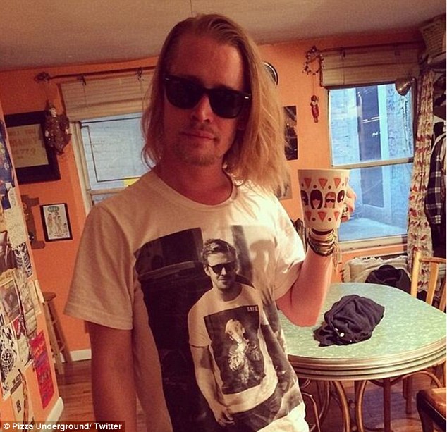 Macaulay Culkin wearing a t-shirt with a pictire of Ryan Gosling wearing a t-shirt that has a picture of Macaulay Culkin.