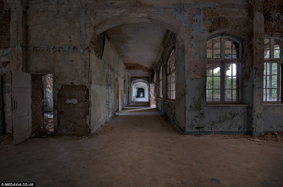 Painting a Thousand Words: An empty corridor in the abandoned hospital, which has been documented by photographer Rosella Ottaviano, 49, from Emilia-Romagna, Italy.