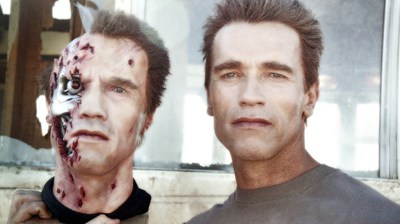 Arnold Schwarzenegger poses with one of his puppet doubles on the set of Terminator 2 - 1990.