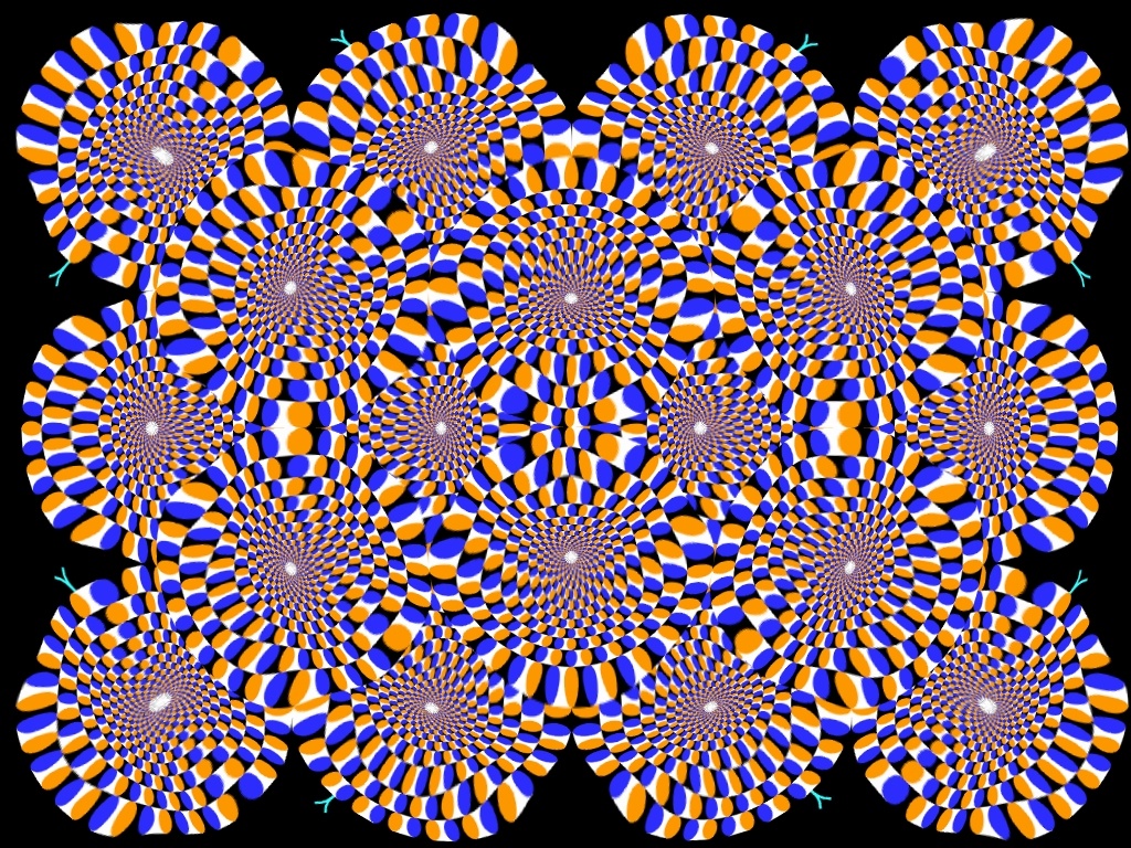 Awesome optical illusion trippy picture of wheels that appear to be turning because of a problem with how our eyes process colors.