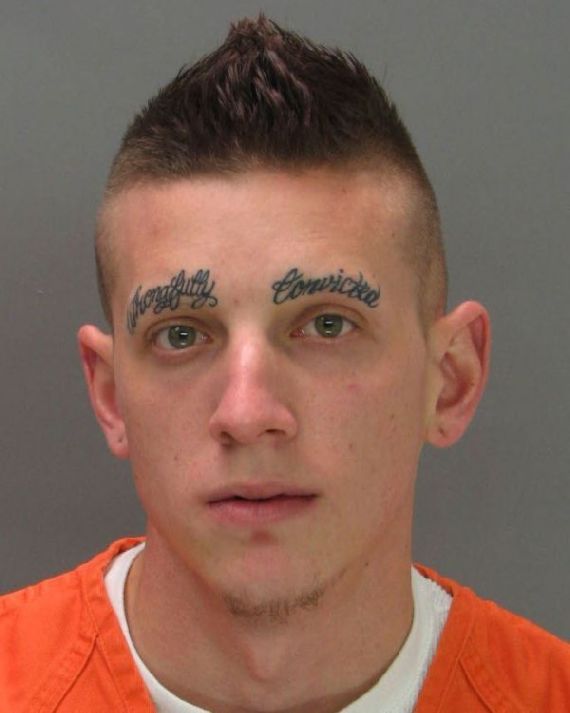 This guy has his mug shot taken with eyebrows shaved off.  Instead of his eyebrows, it says "Wrongfully Convicted".  This guy should be famous