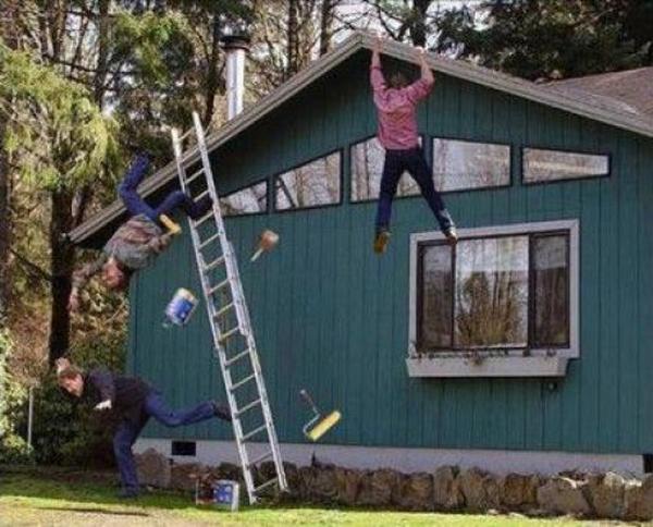 Three Guys in mid air after....what went wrong while painting this house?  It's only one story high for shit sake.