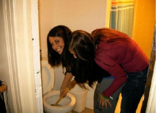 Girls Unclogging Toilets