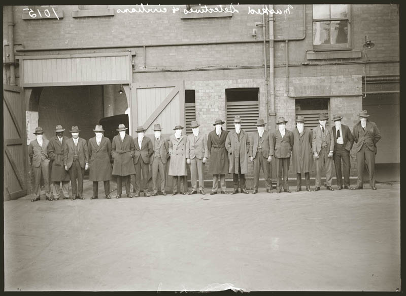Masked detectives and civilians, 1933