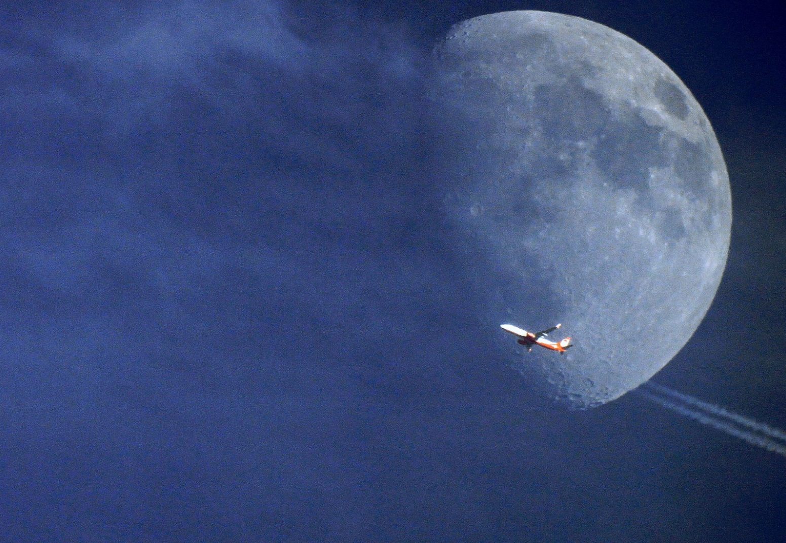 Just The Right Moment: Capturing Planes With The Sun And Moon