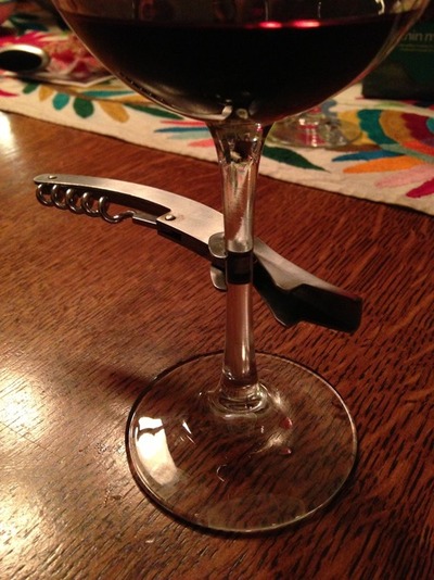 corkscrew and wine glass
