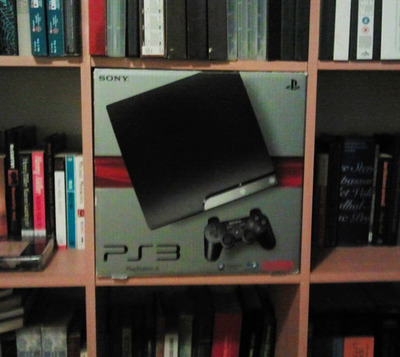 PS3 box and bookshelf