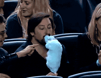 gifs - man eating cotton candy reverse