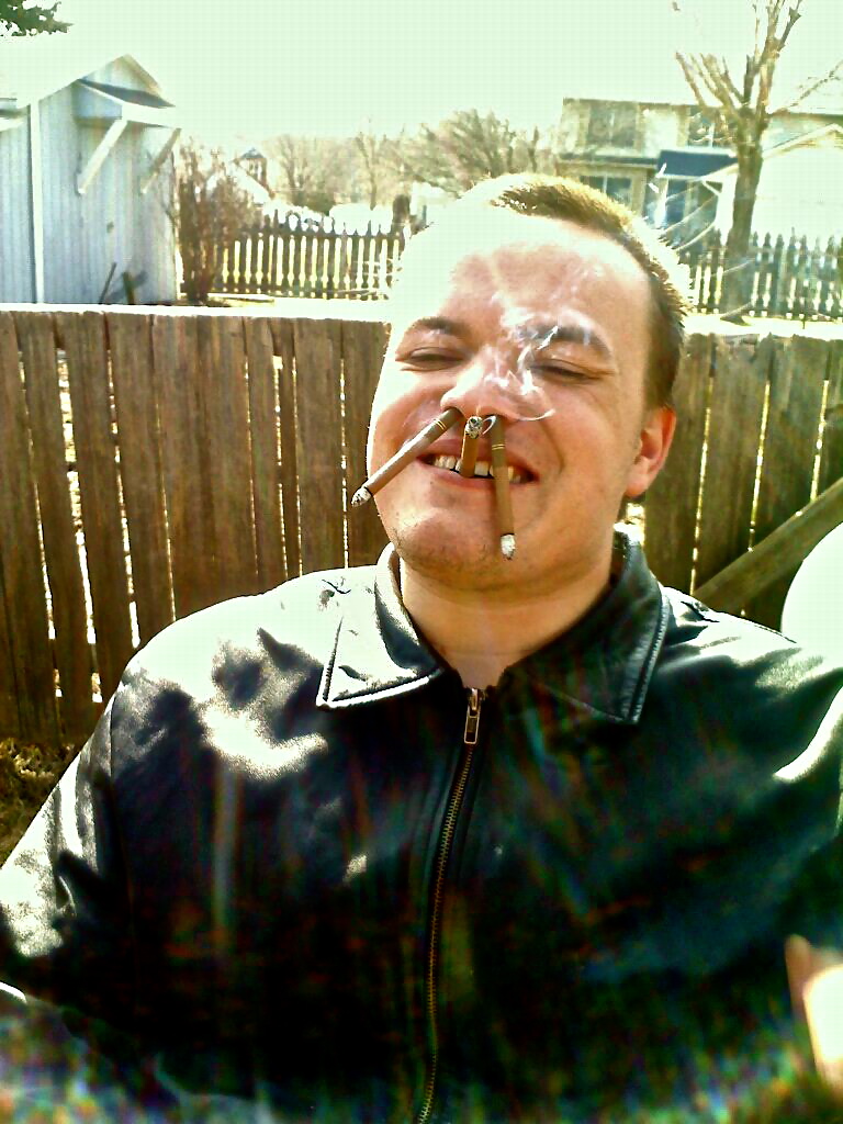 kid smokes 3 cigars 1 in mouth, 2 in nose