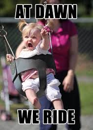 funny picture and caption of baby in swing yelling AT DAWN WE RIDE