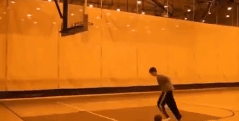 people are awesome gif of person shooting basketball with legs