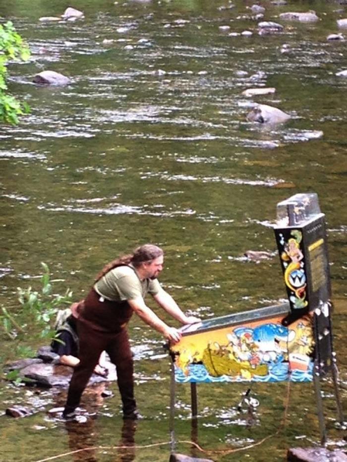 pinball machine in river
