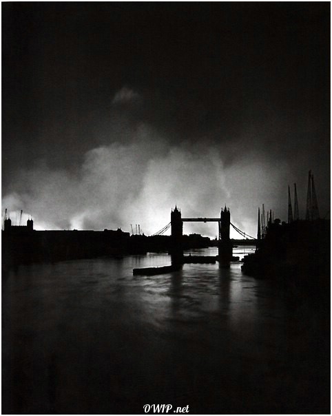 Tower bridge surrounded by smoke from burning building nearby after German Bombings in September 1940