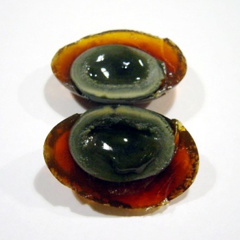 Century Egg - made by preserving duck, chicken or quail eggs in a mixture of clay, ash, salt, lime, and rice straw for several weeks to several months, depending on the method of processing