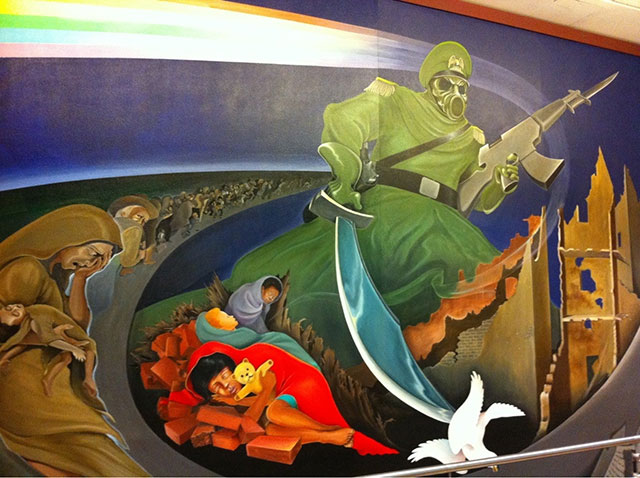 One of the most noticeable and questionable features of the airport is the unorthodox artwork that adorns its walls. Murals that can be viewed in the baggage claim area feature content that, according to some, feature future military oppression and a one world government similar to the concept of big brother. The most memorable of these pieces is a large green soldier of sorts with an eagle symbol on his hat, a bayonet tipped gun and a large curved sword in the other hand.