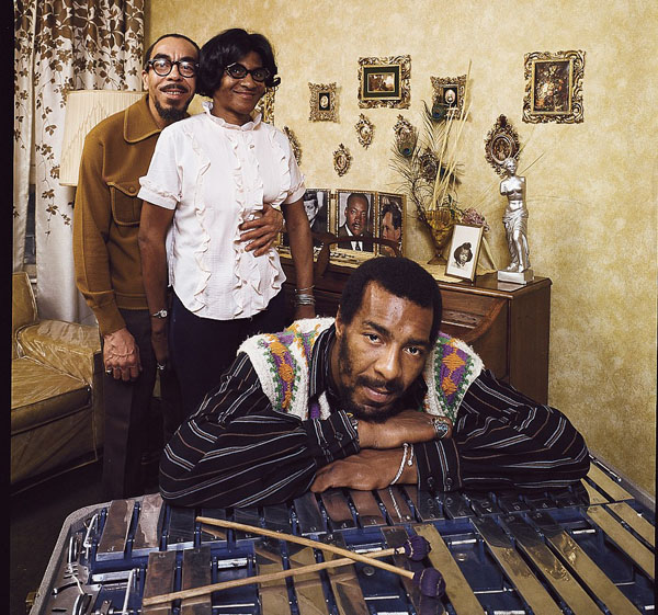 Folk singer Richie Havens leaning on xylophone with parents Richard and Mildred in their apartment in Brooklyn, New York. Richard said his son was the only one of his children to leave home...