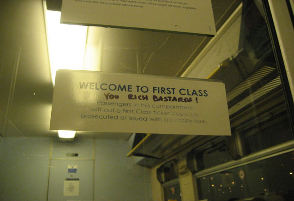 signage - Welcome To First Class You Bach Bastaros ! Passengers in this compartment without a First Class ticket so prosecuted or issued with a nyone