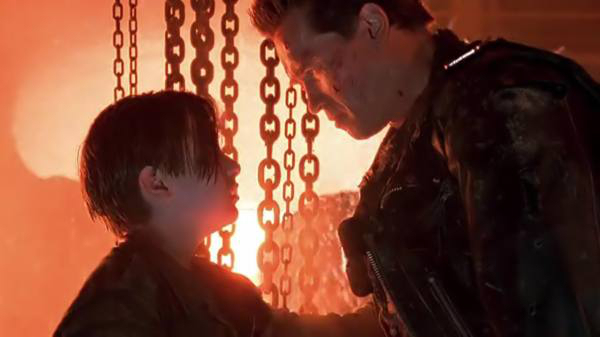 Terminator 2:  In the script, Arnold Schwarzenegger had no lines after saving John from the  T-1000.  The script said "he emerges looking like he needs a vacation"  and after filming the scene several times Arnold decided to give the director a laugh, turning his description into the line " I need a vacation".