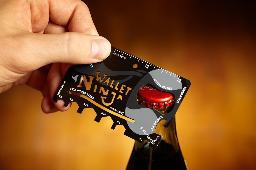 Wallet Ninja-The Wallet Ninja Fits 18 Functional Tools Into A Tiny Wallet Sized Package. Tools Include a Cell Phone Stand, Screw Driver And Bottle Opener.