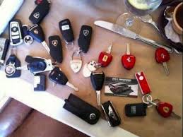 A collection of keys to many fancy and very expensive cars.