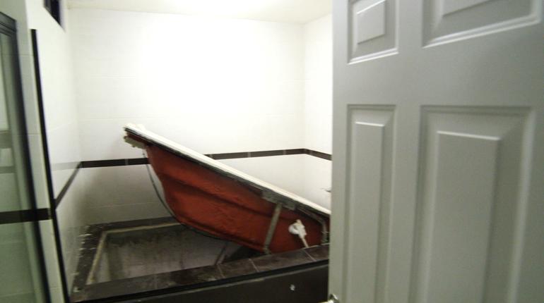 Bathtub leads to top secret escape route, one of many.
