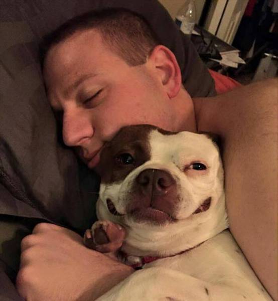 random pic husband cuddling dog