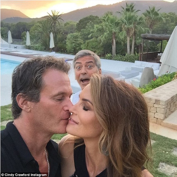 George Clooney interrupts a hot moment between Randy Gerber and Cindy Crawford