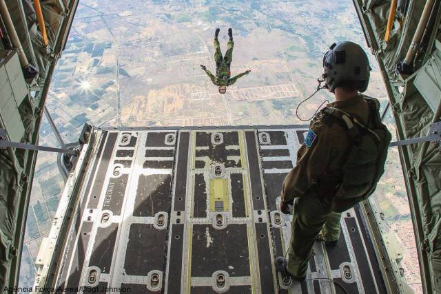 random paratroopers jumping out of plane
