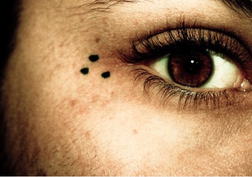 3 Dots by the eye-Those three dots signify “Mi Vida Loca” and means that the person with the tattoo has a gang affiliation, likely of Latin American descent.