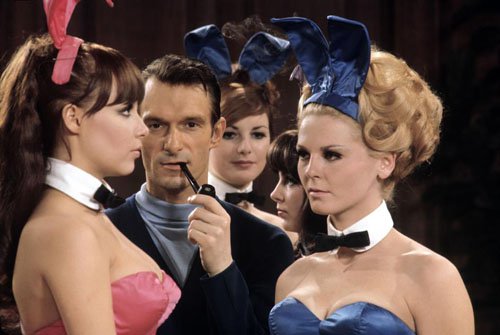 A young Hugh Hefner with a few playmates