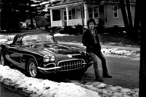 A young Bruce Springsteen with his ’60 Corvette
