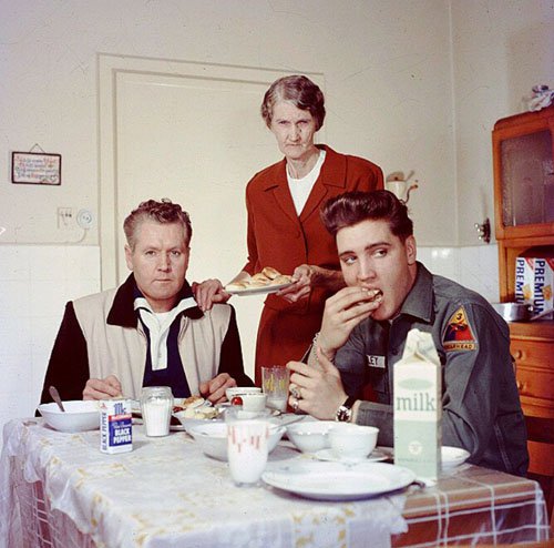 Elvis Presley eating breakfast with his father Vernon, and his grandmother Minnie Mae in 1959