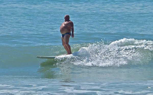 fat guy on surfboard meme