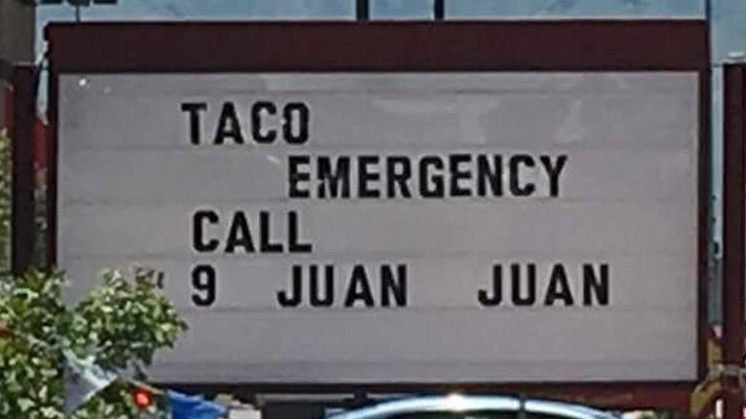 street sign - Taco Emergency Call 9 Juan Juan