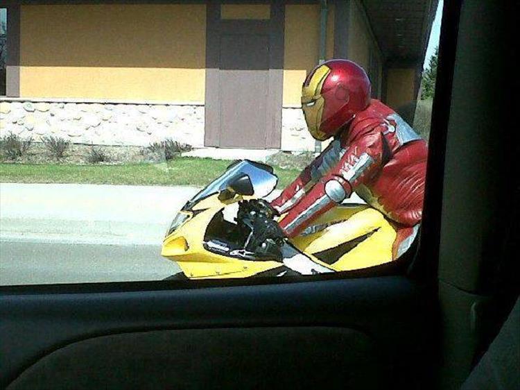 funny picture of man on motorcycle and full Iron Man costume