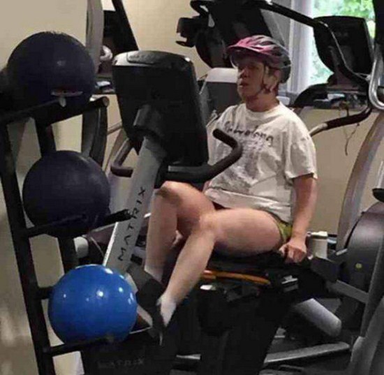 wearing a helmet on a stationary bike