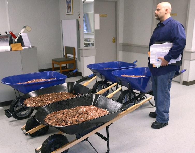 After months of frustration with the DMV, Nick Stafford had finally had enough and chose a weighty way to express himself: thousands and thousands of pennies.
He delivered the $2,987.14 he owed in taxes in five wheelbarrows weighing a combined 1,548 pounds. It took employees more than 12 hours to count them by hand after the DMV's coin counting machines broke.