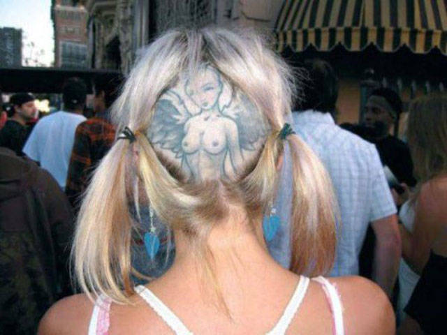 funny picture of a girl with a shaved back head that reveals a tattoo of a topless woman