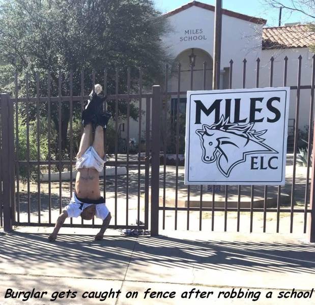 hanging upside down on fence - Miles School Miles Intl Burglar gets caught on fence after robbing a school